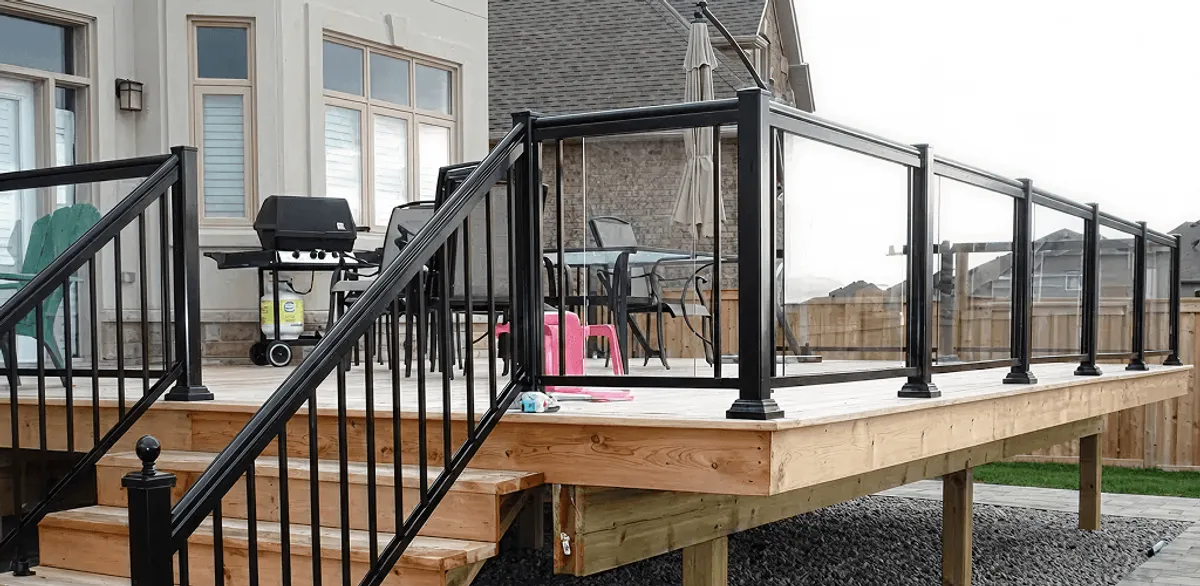 Handrail installation on a deck staircase for safety and code compliance in Fort Collins, CO